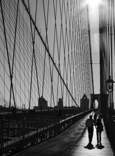 Two silhouettes approaching each other representing embracing inner light and shadow