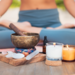 Woman sitting on the floor practicing grounding after noticing signs your chakras are out of balance